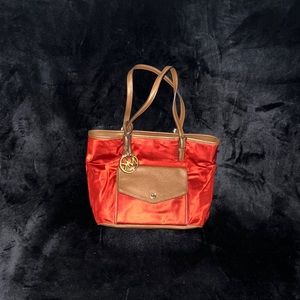 Michael Kors red vinyl and leather bag in good condition